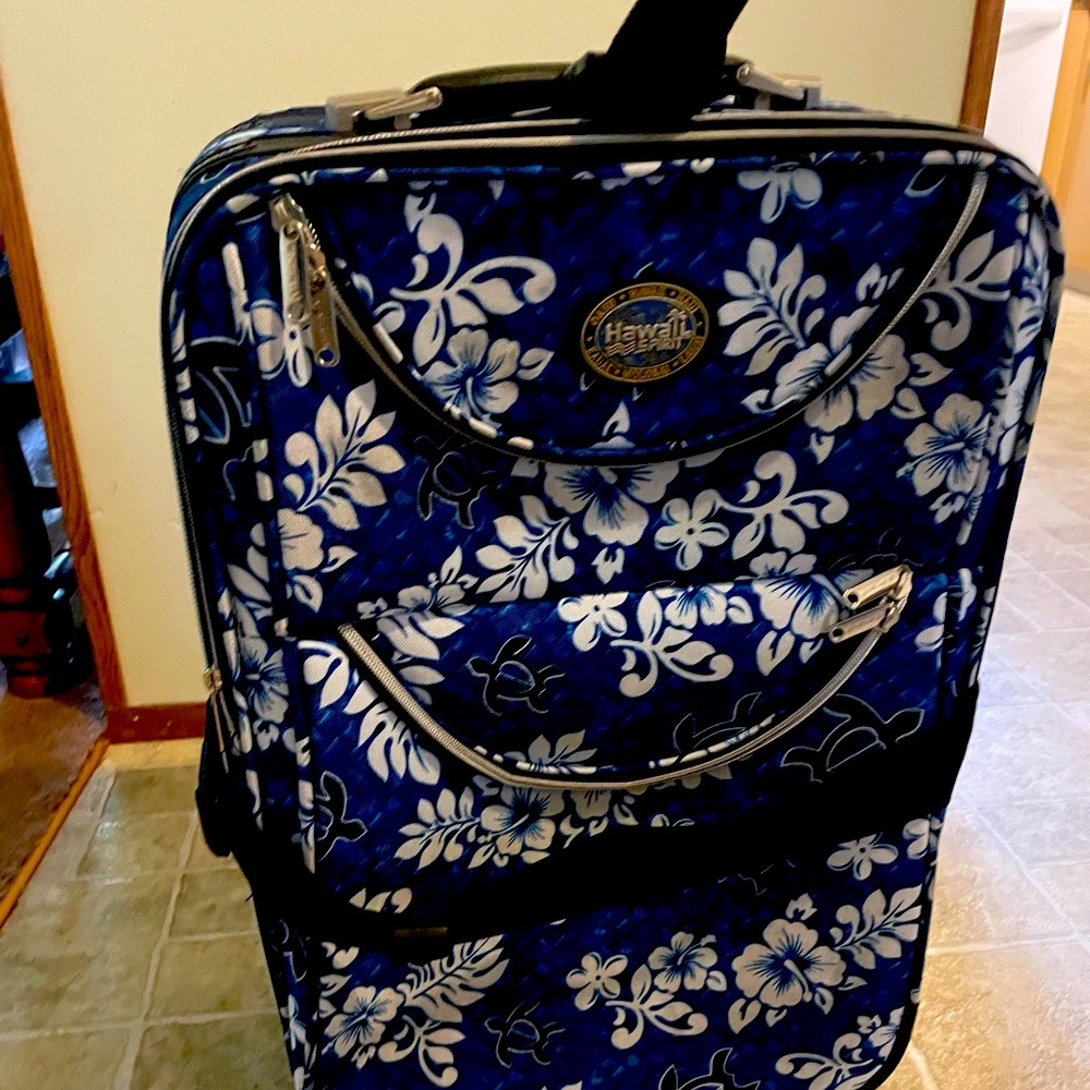 Blue, black and white Hawaii Spirit suit case